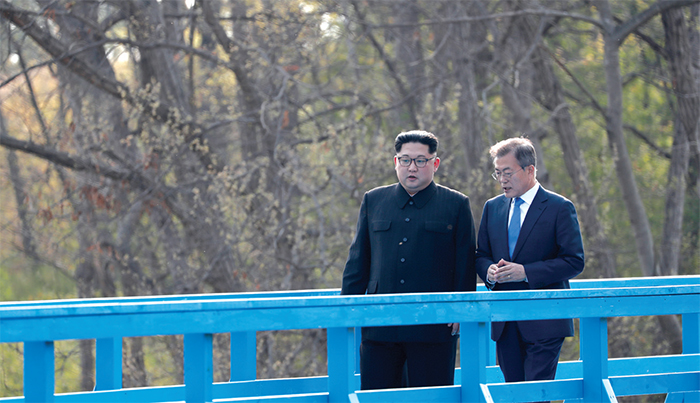 President Moon Jae-in and Chairman Kim Jong Un take a stroll on the footbridge at the inter-Korean border village of Panmunjeom.