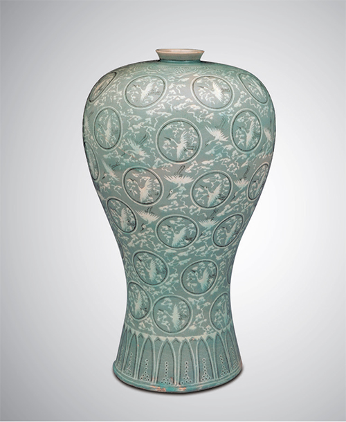 Celadon Prunus Vase with Inlaid Cloud and Crane Design (Goryeo, 12th Century) The jade green celadon ware represents the ceramics of the Goryeo period. The exquisite patterns on these objects were created by inlaying white and black clay into grooves etched on their surface. Inlaid designs such as this are recognized as a unique skill.